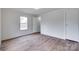 Bedroom featuring a window and wood-look vinyl flooring at 976 Neely Store Rd, Rock Hill, SC 29730