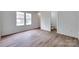 Spacious bedroom featuring bright natural light and wood-look laminate flooring at 976 Neely Store Rd, Rock Hill, SC 29730