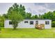 Charming single-story home with white siding, black shutters, front yard, and a wooden porch and stairs at 976 Neely Store Rd, Rock Hill, SC 29730