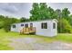 Charming single-story home with white siding, black shutters, and a cozy wooden porch at 976 Neely Store Rd, Rock Hill, SC 29730