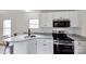 Modern kitchen with stainless steel appliances, granite countertops, and ample cabinet space for storage at 976 Neely Store Rd, Rock Hill, SC 29730