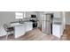 Modern kitchen features white cabinets, stainless steel appliances, and granite countertops for a stylish cooking space at 976 Neely Store Rd, Rock Hill, SC 29730