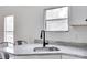 Well-lit kitchen featuring granite countertops, a modern faucet, and updated cabinetry, perfect for culinary enthusiasts at 976 Neely Store Rd, Rock Hill, SC 29730