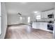 Open-concept living area featuring modern floors and ample natural light, seamlessly connected to the kitchen at 976 Neely Store Rd, Rock Hill, SC 29730
