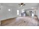 Open-concept living room featuring modern floors, ceiling fan and seamless flow into the bright kitchen at 976 Neely Store Rd, Rock Hill, SC 29730