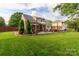 A spacious backyard features a patio and hot tub, great for entertaining at 10209 Green Tee Ln, Charlotte, NC 28277