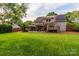 Enjoy this large backyard featuring a hot tub, patio and shade sails at 10209 Green Tee Ln, Charlotte, NC 28277