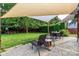 Backyard featuring lounge chairs and a table with an umbrella-style sunshade at 10209 Green Tee Ln, Charlotte, NC 28277
