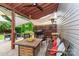 Backyard patio featuring comfortable seating, a grill, and a partial sun shade at 10209 Green Tee Ln, Charlotte, NC 28277