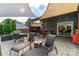 Backyard featuring a brick patio with multiple tables and seating under sunshades at 10209 Green Tee Ln, Charlotte, NC 28277