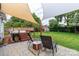 Relax in this backyard featuring a hot tub, patio, and beautiful landscaping at 10209 Green Tee Ln, Charlotte, NC 28277