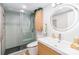 Modern bathroom showcasing a glass enclosed shower, sleek vanity, and stylish fixtures at 10209 Green Tee Ln, Charlotte, NC 28277