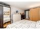 Bedroom features a bed, multiple dressers, wood flooring, and closet with mirrored doors at 10209 Green Tee Ln, Charlotte, NC 28277