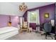 Well lit bedroom with bright purple walls, a large window, and decorative lighting at 10209 Green Tee Ln, Charlotte, NC 28277