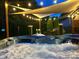 Enjoy the ambiance of the illuminated backyard at night from the hot tub at 10209 Green Tee Ln, Charlotte, NC 28277