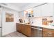 Modern kitchen featuring stainless steel appliances, two tone cabinets, and stylish décor at 10209 Green Tee Ln, Charlotte, NC 28277