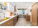 Contemporary kitchen featuring stainless steel appliances, stylish cabinets, and a garden window at 10209 Green Tee Ln, Charlotte, NC 28277