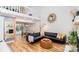 Open-concept living room with high ceilings, a fireplace, and hardwood floors at 10209 Green Tee Ln, Charlotte, NC 28277