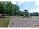 Well-maintained playground with slides, climbing structures, and ample space for children to play at 10209 Green Tee Ln, Charlotte, NC 28277