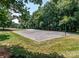 Outdoor sport court featuring basketball, volleyball, and a shaded seating area at 10209 Green Tee Ln, Charlotte, NC 28277