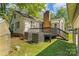 Back deck with black railings on a home with a brick chimney at 1072 5Th Ne St, Hickory, NC 28601