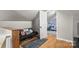 Inviting bonus room featuring hardwood floors, vaulted ceilings, and a comfortable seating area at 1072 5Th Ne St, Hickory, NC 28601