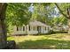 Charming single-story home with mature trees and a well-maintained lawn in a quiet neighborhood at 1072 5Th Ne St, Hickory, NC 28601