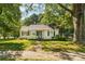 Charming home featuring a well-maintained front lawn with mature trees at 1072 5Th Ne St, Hickory, NC 28601