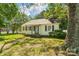 Charming home featuring a well-maintained front lawn and mature trees at 1072 5Th Ne St, Hickory, NC 28601