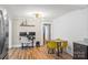 Bright eat-in kitchen with granite countertops, stainless steel appliances, and hardwood floors at 1072 5Th Ne St, Hickory, NC 28601