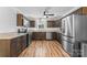 Well-appointed kitchen featuring granite countertops, stainless steel appliances, and hardwood floors at 1072 5Th Ne St, Hickory, NC 28601