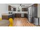 Modern kitchen featuring stainless steel appliances, dark wood cabinetry, and a window above the sink at 1072 5Th Ne St, Hickory, NC 28601
