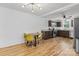 Open concept kitchen with dark wood cabinets, stainless appliances, and seating for four at 1072 5Th Ne St, Hickory, NC 28601