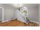 Bright entryway with a modern staircase featuring wood floors and neutral walls at 1072 5Th Ne St, Hickory, NC 28601