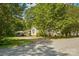 Quaint home with carport and lush greenery from a peaceful street view at 1072 5Th Ne St, Hickory, NC 28601