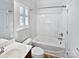 Bathroom with a shower-tub combo, a window and a single sink vanity at 1090 Mclaren Dr, Belmont, NC 28012