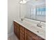 Bathroom featuring double sink vanity, large mirror, bathtub, and ample natural light at 1090 Mclaren Dr, Belmont, NC 28012