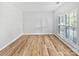 A versatile room with wood floors and great light is an open canvas for new owners at 1090 Mclaren Dr, Belmont, NC 28012