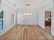 The dining room features beautiful moldings, hardwood floors, and an elegant chandelier at 1090 Mclaren Dr, Belmont, NC 28012