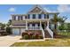 Charming brick two-story home featuring a welcoming front porch and well-manicured landscaping at 1090 Mclaren Dr, Belmont, NC 28012