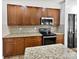 Kitchen featuring granite countertops, stainless steel appliances, and wood cabinets at 1090 Mclaren Dr, Belmont, NC 28012