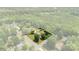 This aerial view shows the location of the property surrounded by mature trees in a quiet neighborhood at 111 Kelly Ln, Gastonia, NC 28056