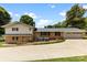 The back exterior of the home features a brick facade and an attached two-car garage at 111 Kelly Ln, Gastonia, NC 28056