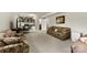 A finished basement with patterned sofas, a table with chairs, and carpeted flooring at 111 Kelly Ln, Gastonia, NC 28056