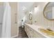Bathroom featuring double sinks, floral wallpaper, and a shower with grab bars at 111 Kelly Ln, Gastonia, NC 28056