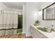 Bathroom featuring sleek counters, a green sink, and a shower/tub combo at 111 Kelly Ln, Gastonia, NC 28056