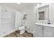 Well-lit bathroom featuring a shower, toilet, vanity with sink, and modern fixtures at 111 Kelly Ln, Gastonia, NC 28056