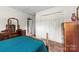 Bedroom with double closets, natural light, and wood furnishings at 111 Kelly Ln, Gastonia, NC 28056