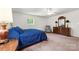 Bright bedroom featuring plush carpeting, a ceiling fan, and ample natural light at 111 Kelly Ln, Gastonia, NC 28056