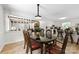 Bright dining area with wood floors, decorative table and chairs, plus views to the kitchen at 111 Kelly Ln, Gastonia, NC 28056